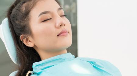 IV-Sedation-Dentistry-Woman-Sleeping-Dentist-Chair.jpg